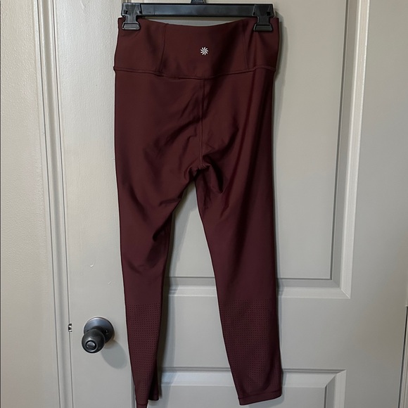 Athleta Interval High Rise Perforated Legging. Size medium. Color is Garnet - Picture 3 of 10